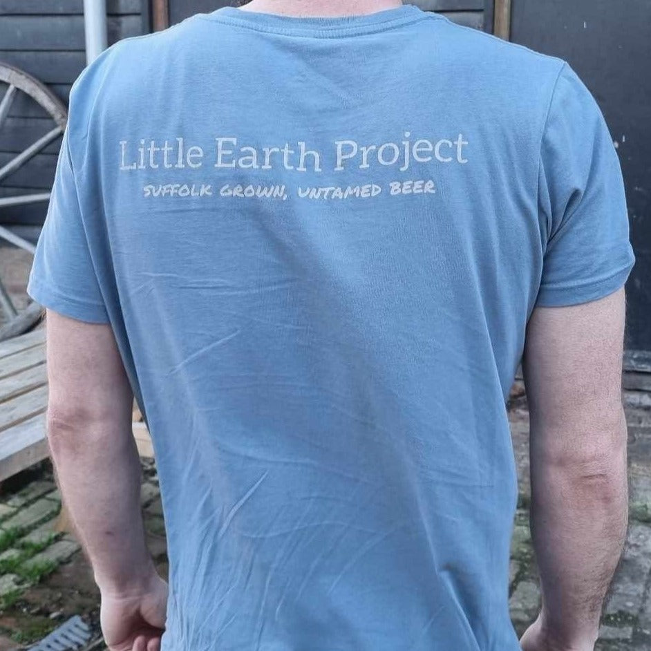Organic cotton tshirt in sky blue with Little Earth Project and tagline across upper back.